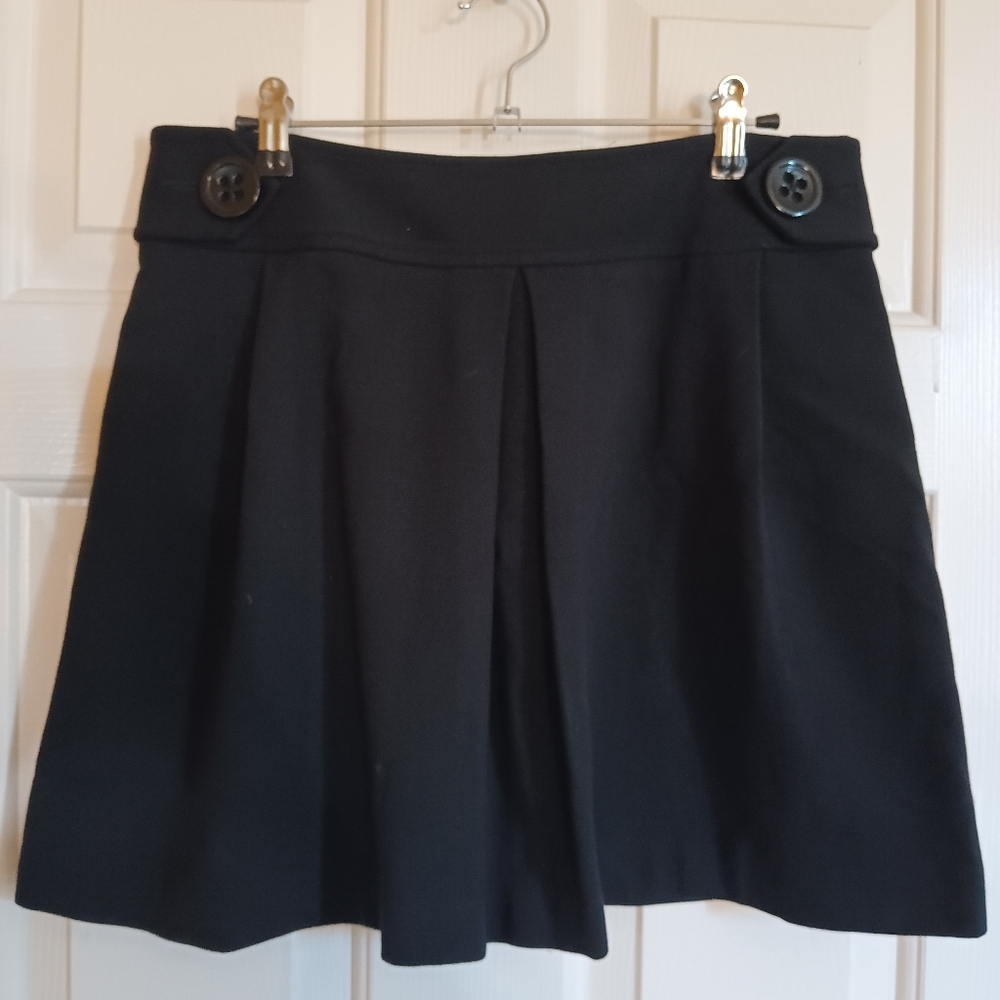Nice knit skirt with one big pleat and funky buttons